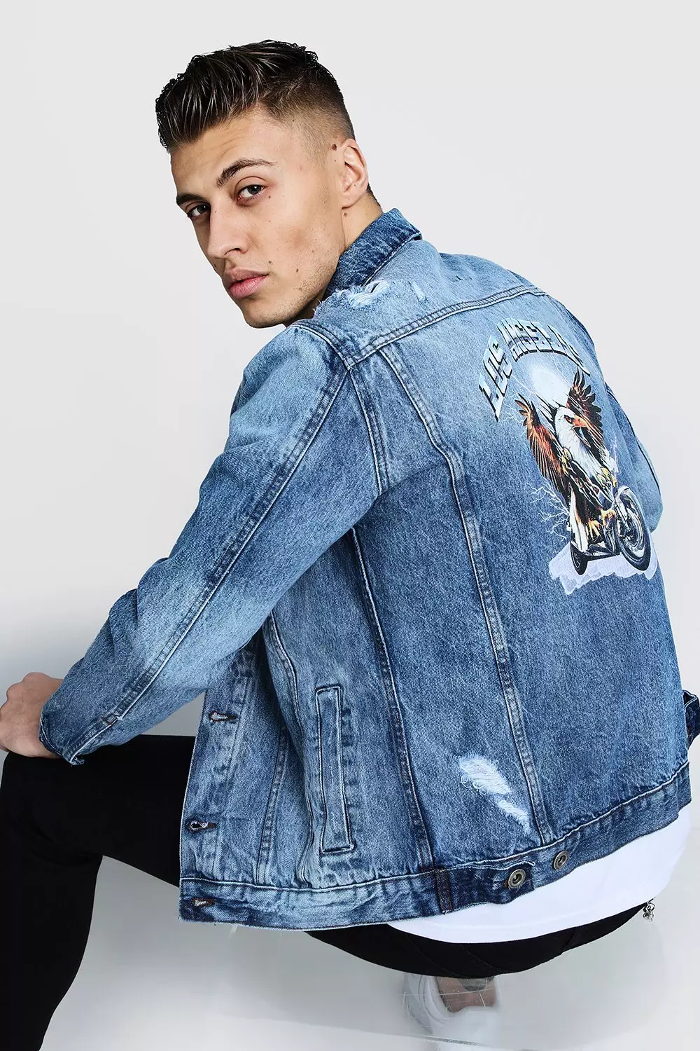 Denim jackets with store designs on back